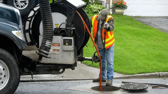 Technician using specialized drainage equipment for sewer line cleaning and foundation protection in Arvada, CO